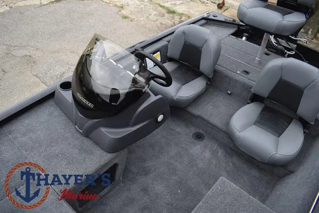 Slide: The Image of 2024 Tracker Pro 170 boat interior with steering console and seating. - 23