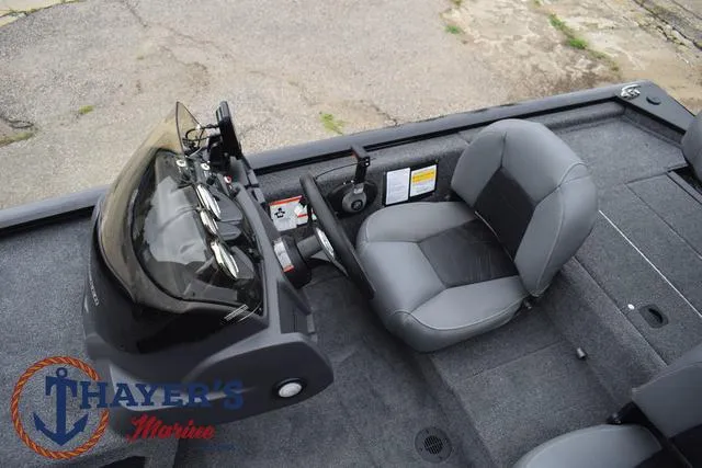 Slide: The Image of 2024 Tracker Pro 170 boat interior with steering console and seating. - 24