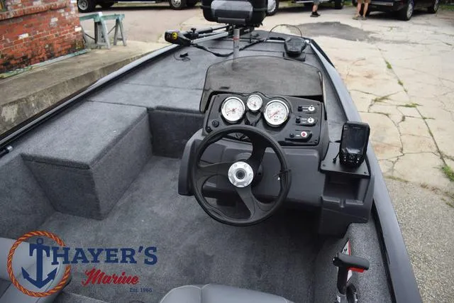 Slide: The Image of 2024 Tracker Pro 170 boat interior with steering wheel and control panel at Thayer's Marine. - 25