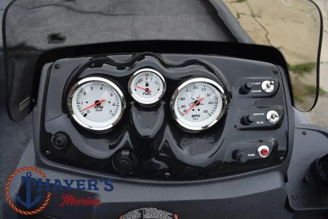 Slide: The Image of 2024 Tracker Pro 170 boat dashboard with RPM, fuel, and speed gauges. - 27