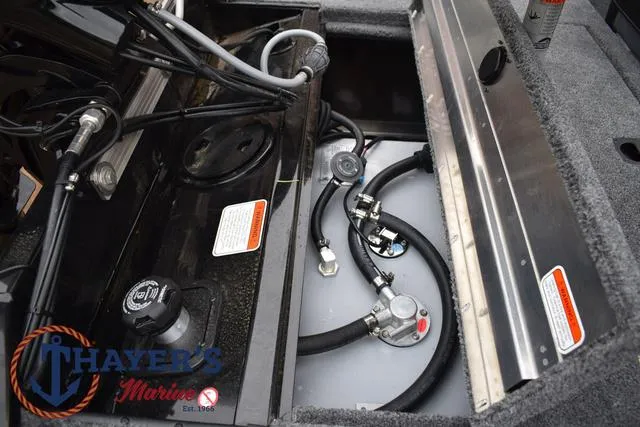 Slide: The Image of 2024 Tracker Pro 170 boat engine compartment with fuel system and wiring. - 31