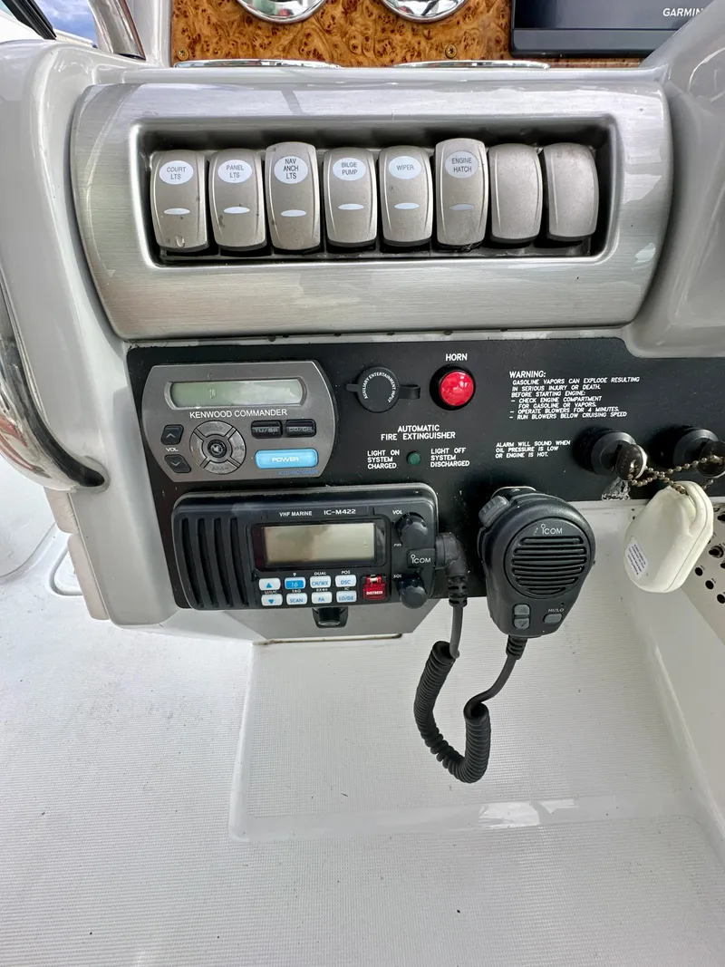 Slide: The Image of Control panel of a 2008 Formula 310 Bowrider boat with radio and switches. - 10