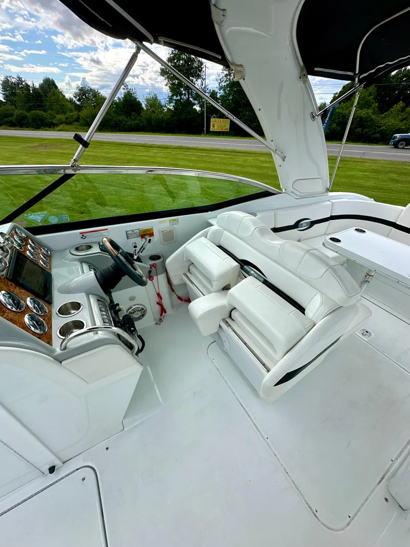 Slide: The Image of 2008 Formula 310 Bowrider interior with white seating and control panel. - 11
