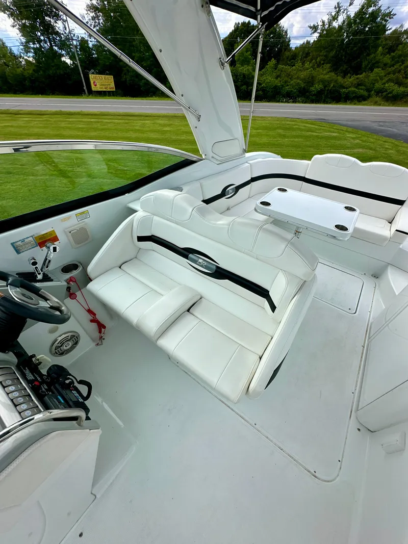 Slide: The Image of 2008 Formula 310 Bowrider interior with white seating and steering wheel. - 12
