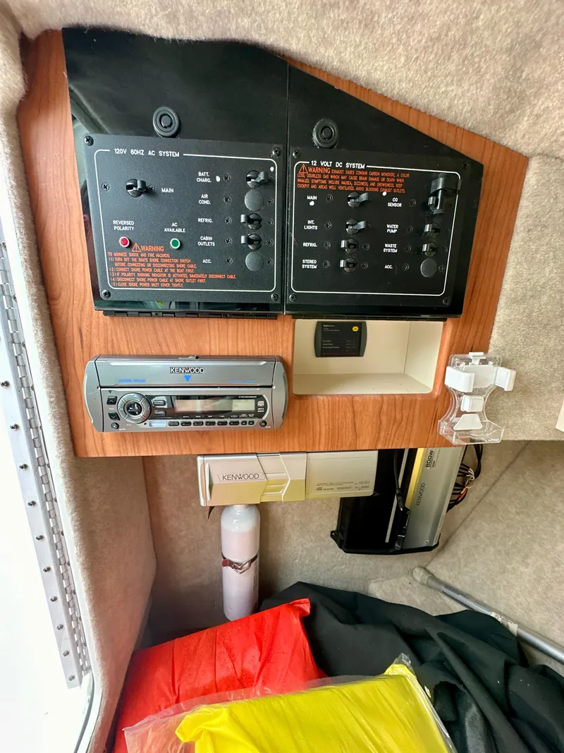 Slide: The Image of Control panel and stereo system inside a 2008 Formula 310 Bowrider boat cabin. - 14