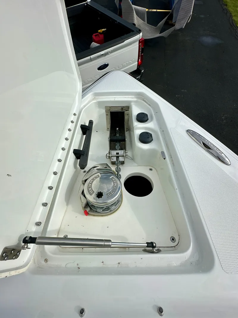 Slide: The Image of 2008 Formula 310 Bowrider anchor compartment with open hatch and winch system. - 17