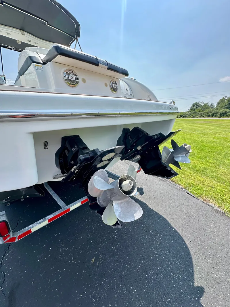Slide: The Image of 2008 Formula 310 Bowrider boat with dual propellers on a trailer. - 26
