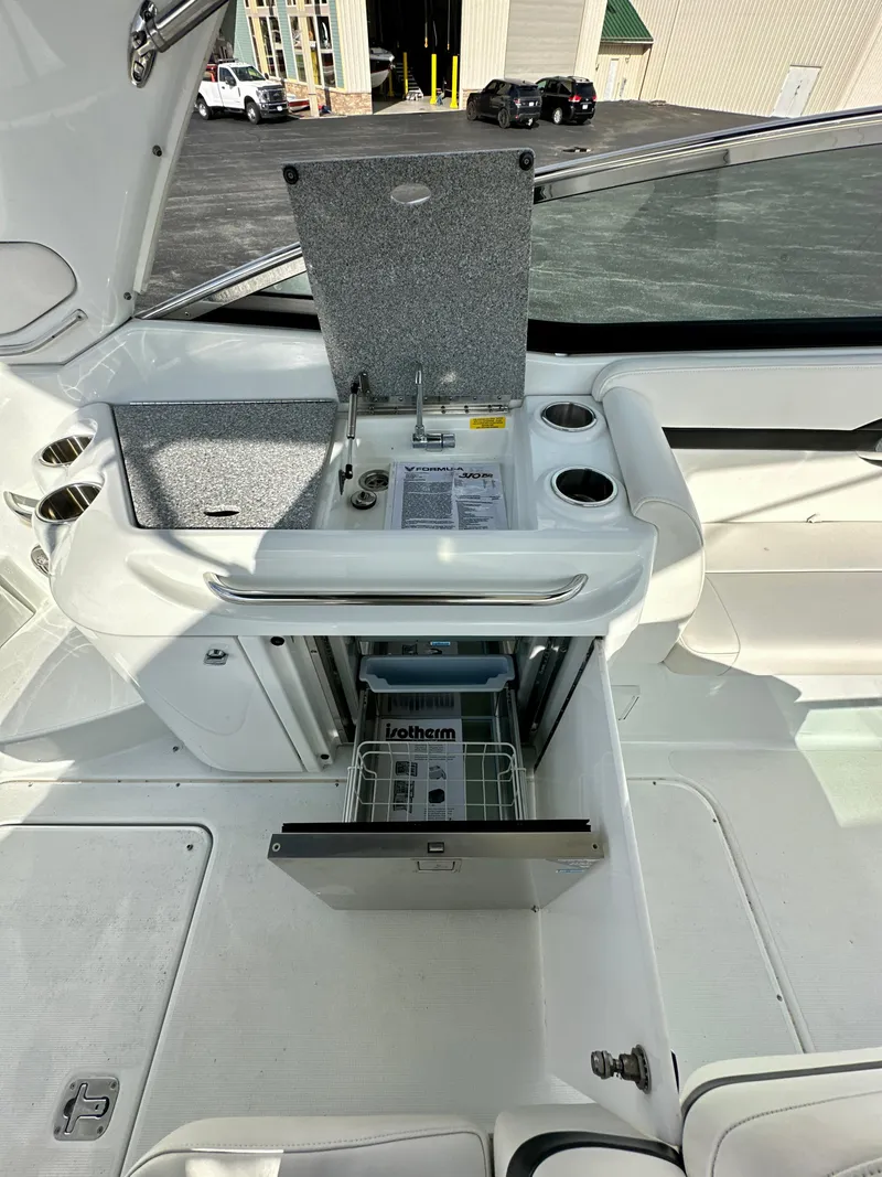 Slide: The Image of 2008 Formula 310 Bowrider boat interior with sink and storage area. - 3