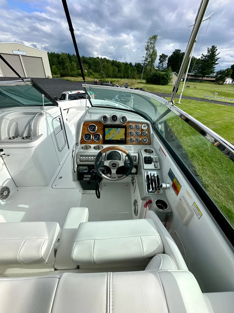 Slide: The Image of 2008 Formula 310 Bowrider cockpit with steering wheel, gauges, and navigation system. - 5