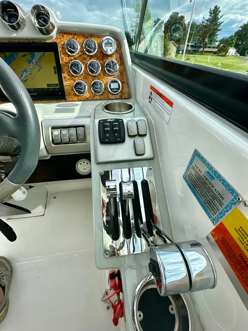 Slide: The Image of Control panel of a 2008 Formula 310 Bowrider boat with gauges and navigation screen. - 7
