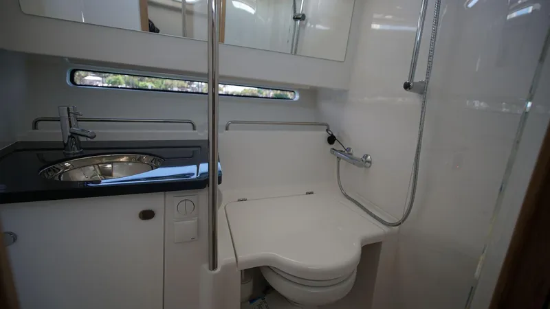 Slide: The Image of 2024 Nimbus Commuter 11 #082 boat bathroom with sink, toilet, and shower. - 21