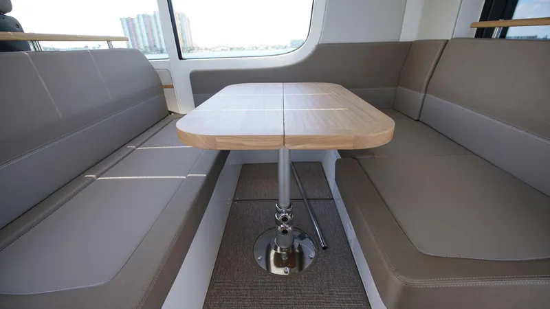 Slide: The Image of Interior seating and table of 2024 Nimbus Commuter 11 #082 boat. - 5