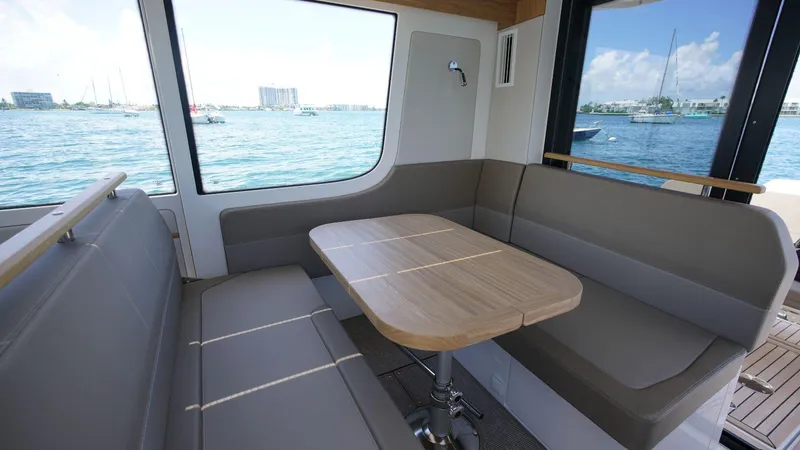 Slide: The Image of 2024 Nimbus Commuter 11 #082 interior dining area with waterfront view. - 6
