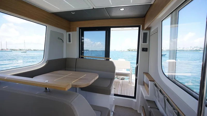 Slide: The Image of Interior of 2024 Nimbus Commuter 11 #082 boat with ocean view through windows. - 7