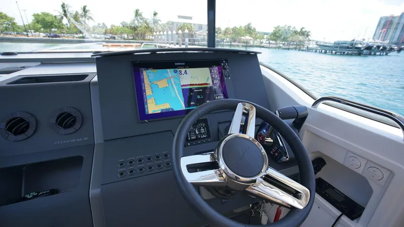 Slide: The Image of Dashboard of 2024 Nimbus Commuter 11 #082 boat with navigation screen and steering wheel. - 9