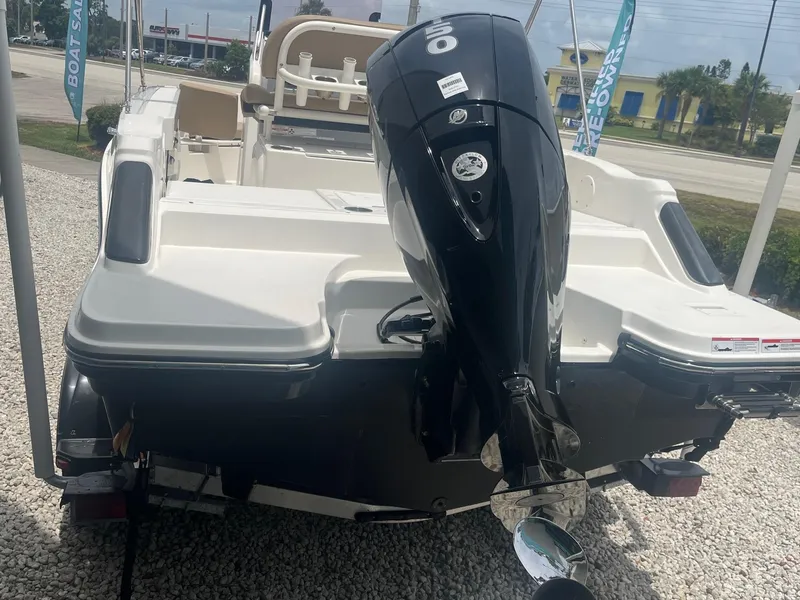 Slide: The Image of 2022 Bayliner Trophy T20CC boat with outboard motor, rear view. - 2