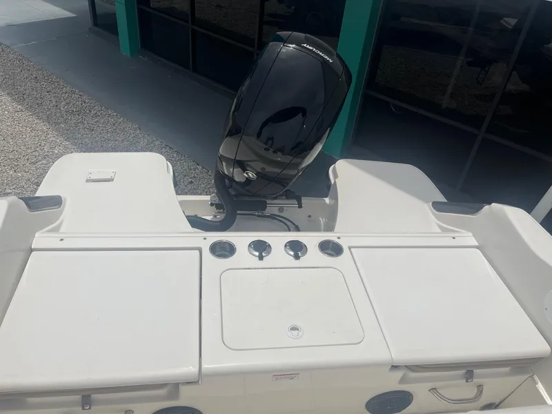 Slide: The Image of 2022 Bayliner Trophy T20CC boat with outboard motor and control panel. - 4