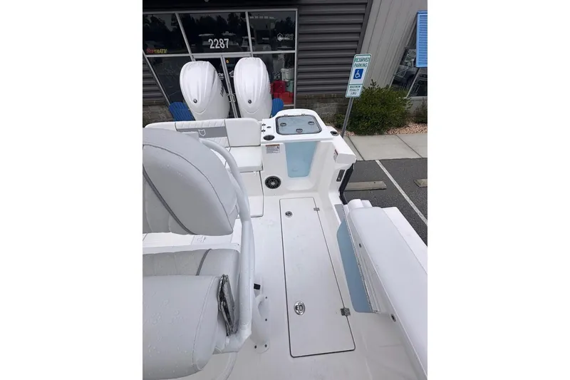 Slide: The Image of 2025 Sea Fox 268 Commander boat interior with dual outboard motors. - 10