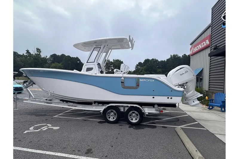 Slide: The Image of 2025 Sea Fox 268 Commander boat on trailer in parking lot. - 5