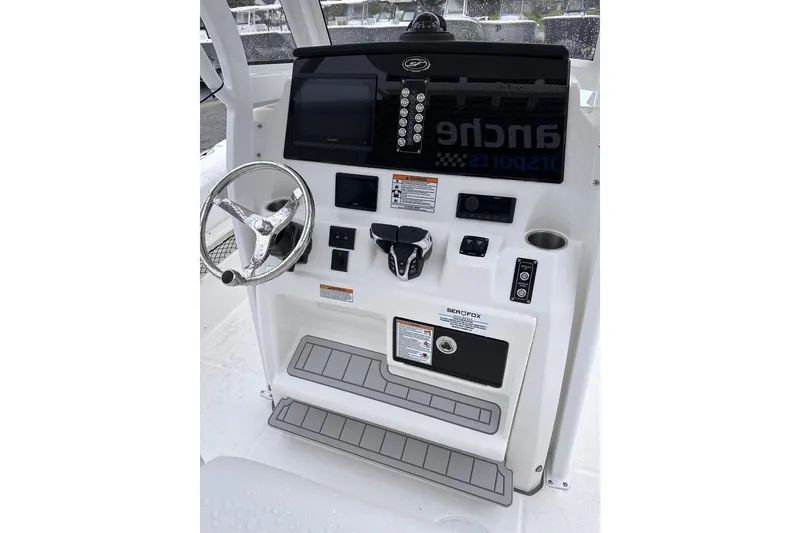 Slide: The Image of 2025 Sea Fox 268 Commander boat console with steering wheel and control panel. - 8