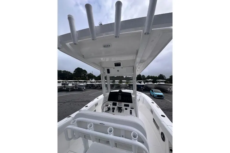 Slide: The Image of 2025 Sea Fox 268 Commander boat interior with helm station and rod holders. - 9