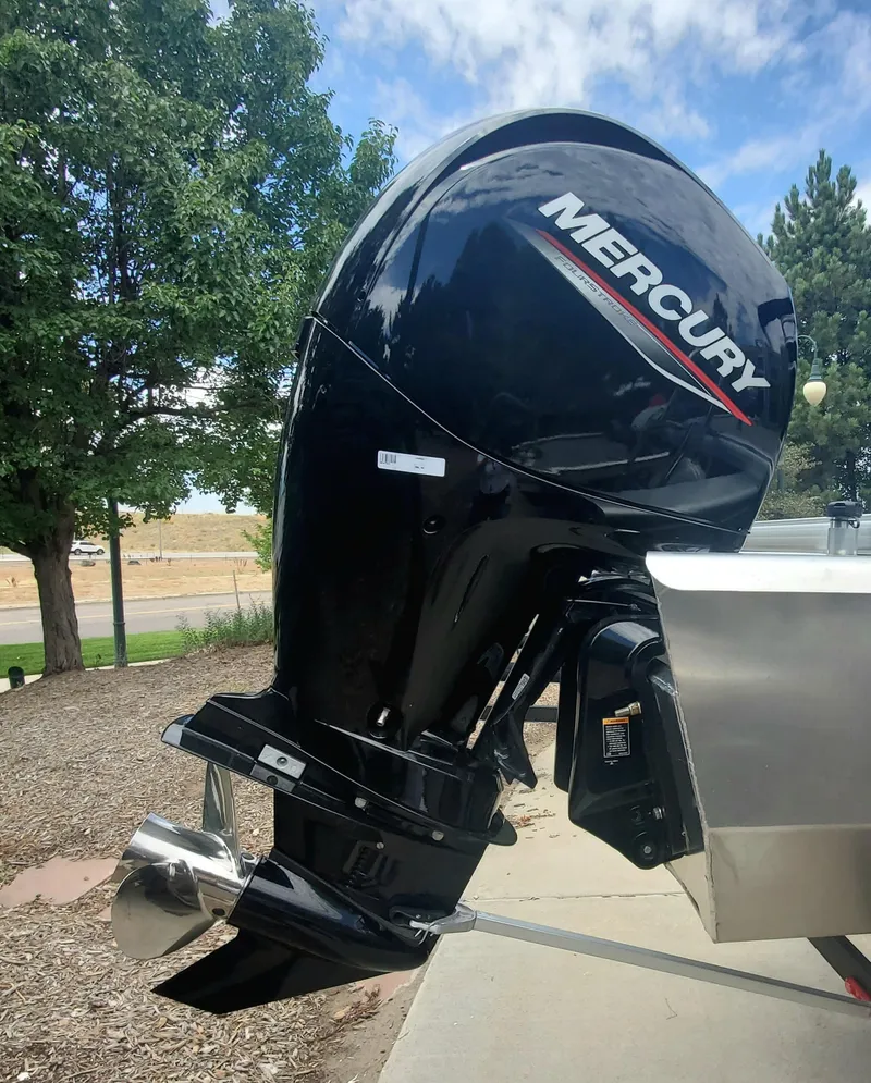 Slide: The Image of 2024 Sun Tracker Sportfish 24 XP3 with Mercury outboard motor. - 5