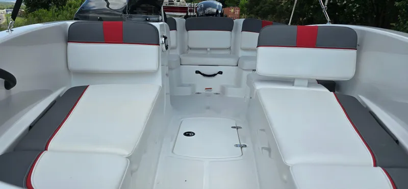 Slide: The Image of 2024 Tahoe T16 boat interior with white and gray seating, red accents. - 5