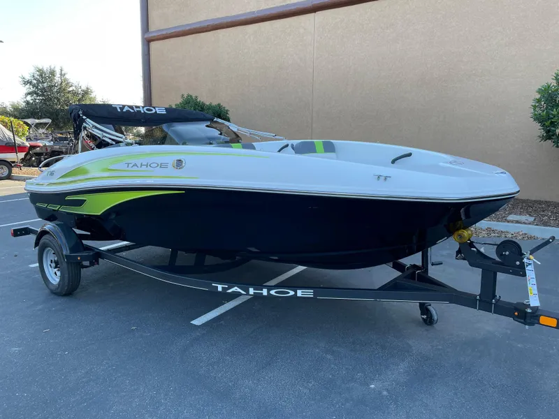 Slide: The Image of 2024 Tahoe T16 boat on trailer, sleek design, parked outdoors. - 1