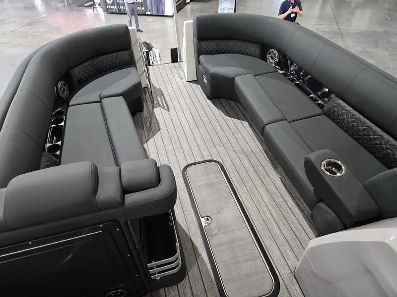 Slide: The Image of 2025 Harris Grand Mariner 250 pontoon boat interior with luxurious seating and modern design. - 3
