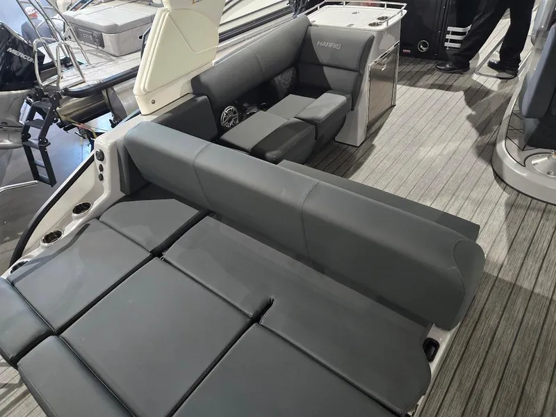 Slide: The Image of 2025 Harris Grand Mariner 250 boat interior with gray seating and modern design. - 4