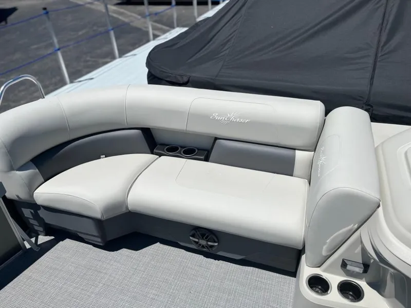 Slide: The Image of 2024 SunChaser Vista 20 LR pontoon boat with comfortable seating and cup holders. - 4