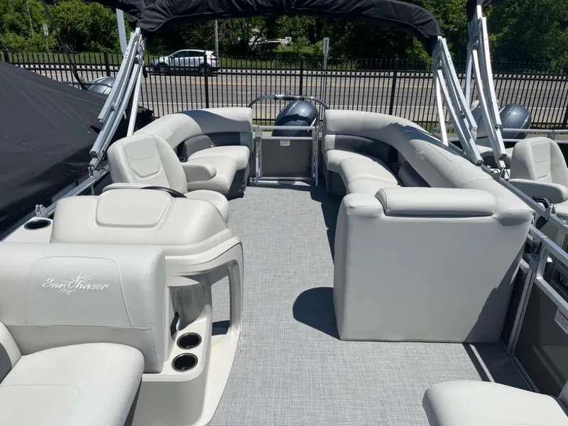 Slide: The Image of 2024 SunChaser Vista 20 LR pontoon boat with spacious seating and modern design. - 6
