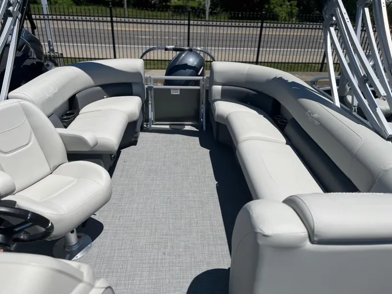 Slide: The Image of 2024 SunChaser Vista 20 LR pontoon boat interior with plush seating and modern design. - 9