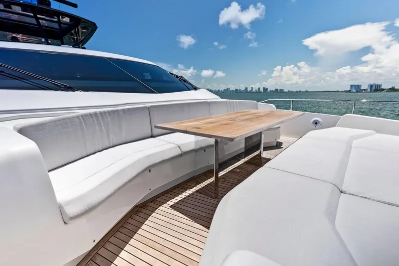 Slide: The Image of Luxurious 2022 Ferretti Yachts 850 deck with elegant seating and ocean view. - 21