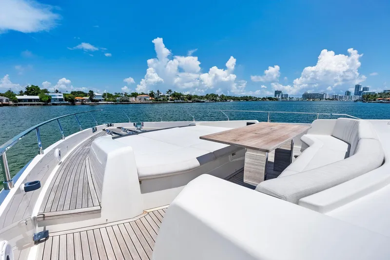 Slide: The Image of Luxurious 2022 Ferretti Yachts 850 with spacious deck and scenic waterfront view. - 22