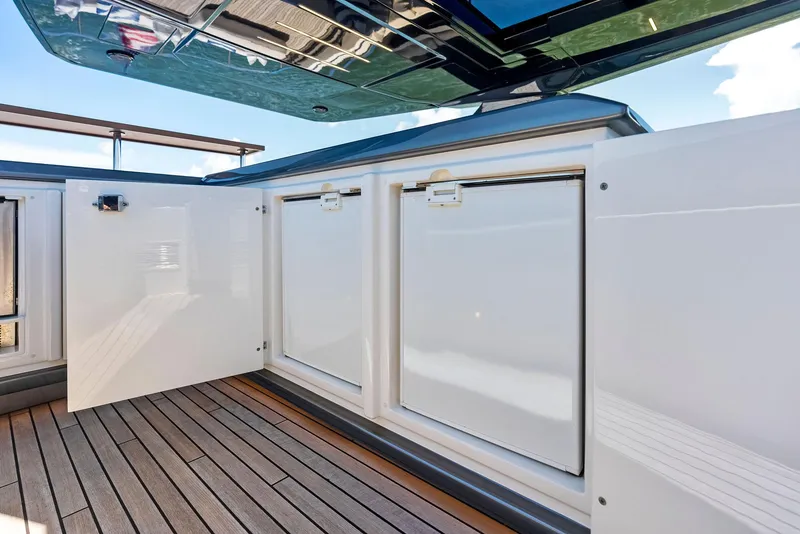 Slide: The Image of Ferretti Yachts 850, 2022 model, featuring sleek storage compartments on deck. - 39