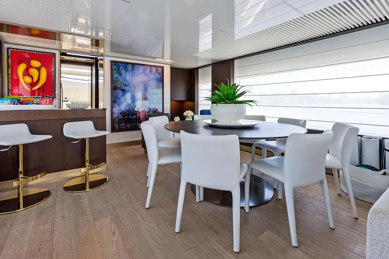 Slide: The Image of Luxurious interior of 2022 Ferretti Yachts 850 with modern dining area and stylish decor. - 49