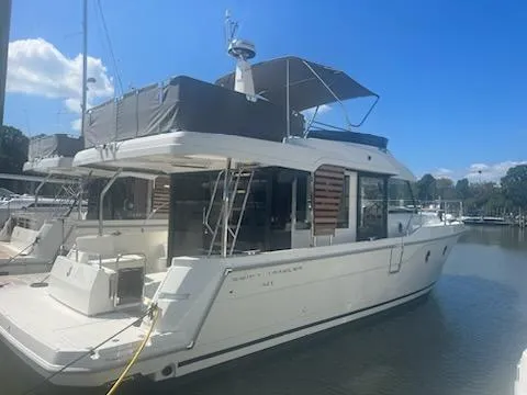 Slide: The Image of 2025 Beneteau Swift Trawler 41 Fly docked under clear blue sky. - 8