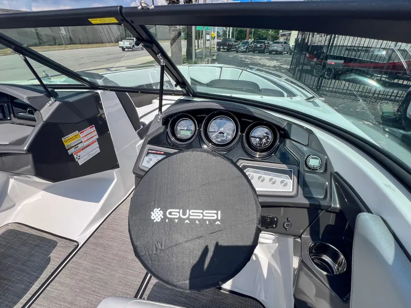 Slide: The Image of 2024 Monterey 218 SS boat dashboard with Gussi Italia steering wheel cover. - 12