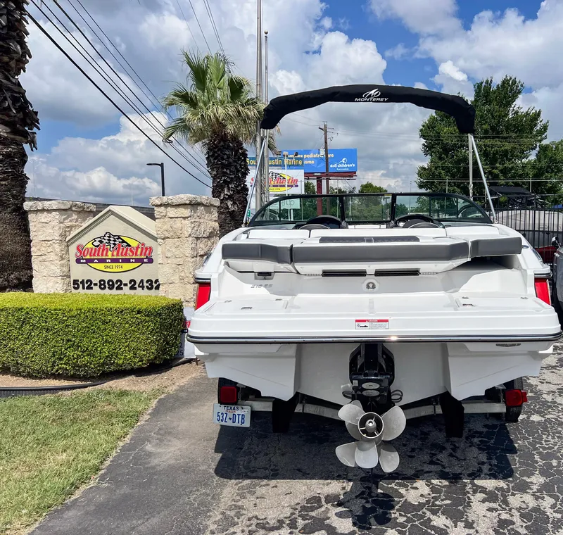 Slide: The Image of 2024 Monterey 218 SS boat parked at South Austin Marine dealership. - 5