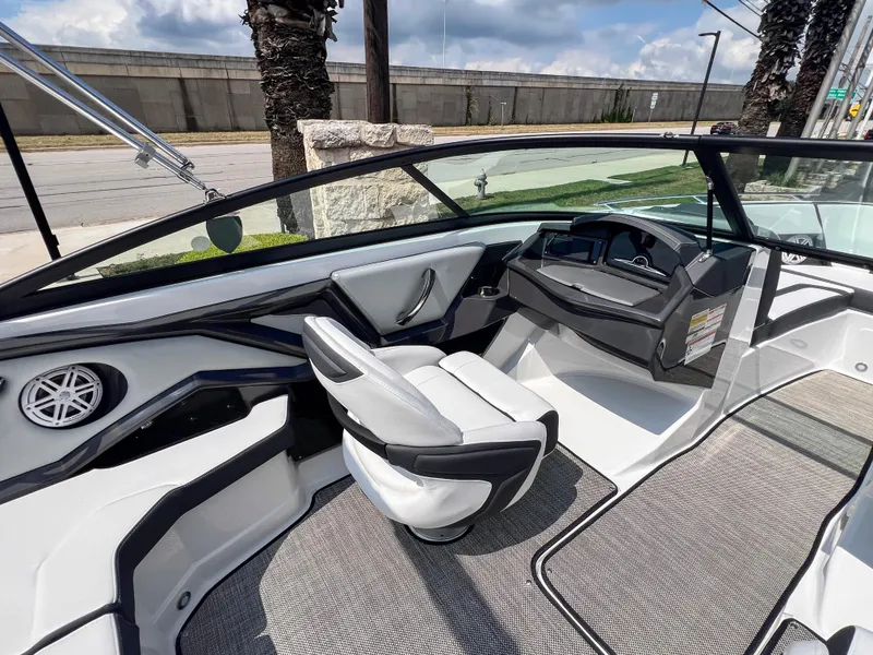 Slide: The Image of 2024 Monterey 218 SS boat interior with sleek design and modern dashboard. - 9