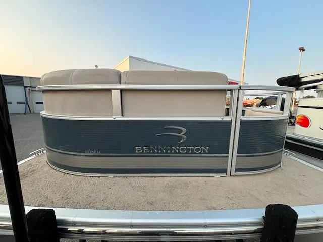 Slide: The Image of 2009 Bennington 2575RLi pontoon boat on trailer at marina. - 21