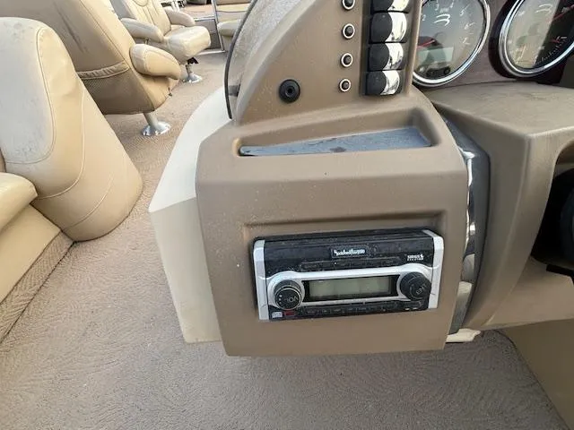 Slide: The Image of 2009 Bennington 2575RLi boat dashboard with Rockford Fosgate stereo system. - 5