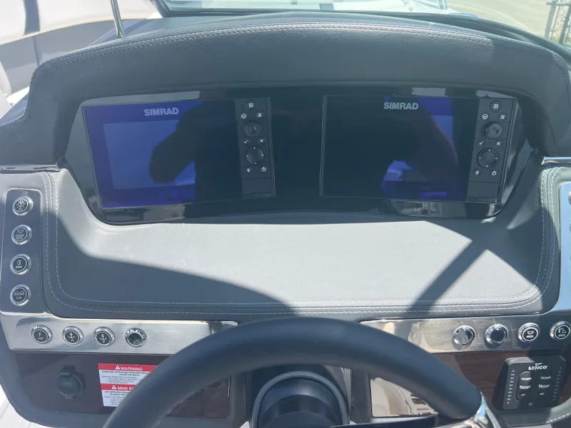 Slide: The Image of 2024 Chaparral 270 OSX dashboard with dual Simrad displays. - 11