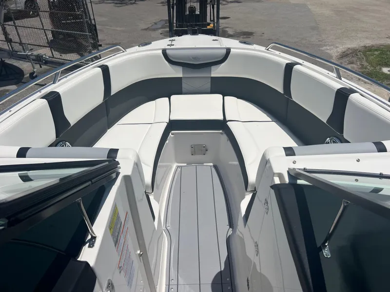 Slide: The Image of 2024 Chaparral 270 OSX boat interior with white and black seating. - 12