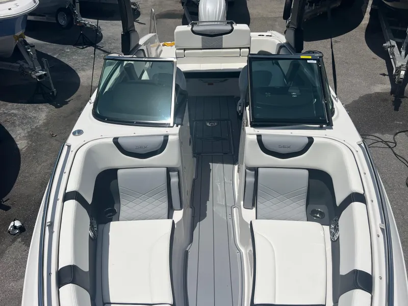Slide: The Image of 2024 Chaparral 270 OSX boat interior with luxurious seating and modern design. - 15