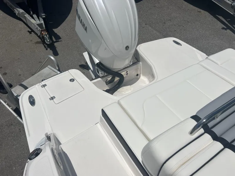 Slide: The Image of 2024 Chaparral 270 OSX boat stern with outboard motor and swim platform. - 19