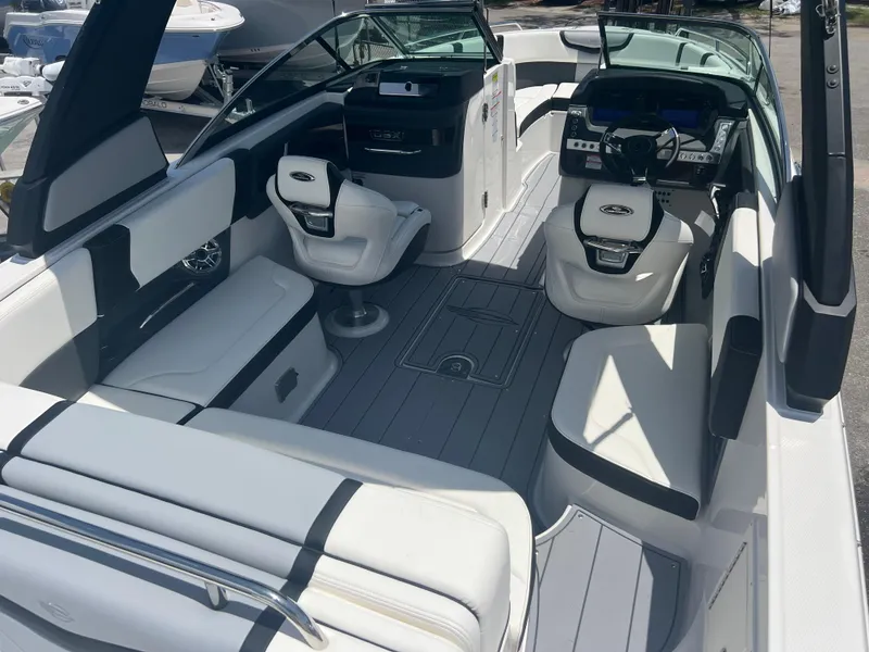 Slide: The Image of 2024 Chaparral 270 OSX boat interior with modern seating and dashboard. - 6