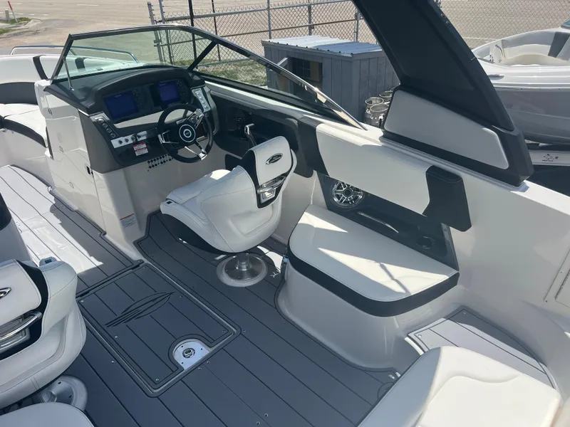 Slide: The Image of 2024 Chaparral 270 OSX boat interior with modern helm and seating. - 8
