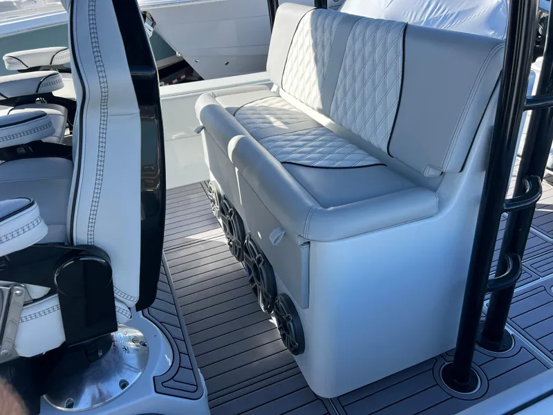 Slide: The Image of 2024 Contender 39 ST Center Console interior with white seating and modern design. - 12